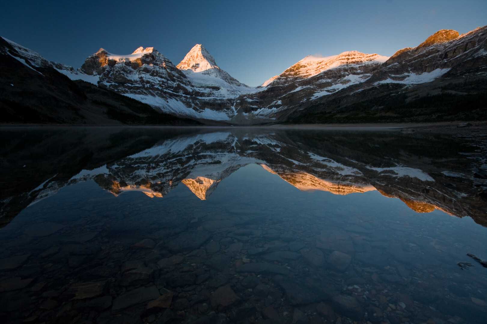Mount Assiniboine reflected in Sunburst Lake in the Canadian Rockies